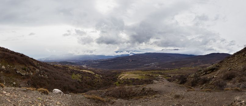 Sunset and clouds in the canyon of mountains. Panorama view. Demerdzhi, Crimea, Russia.