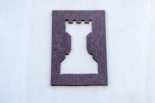 Symbol of a chess club, rook on the wall.