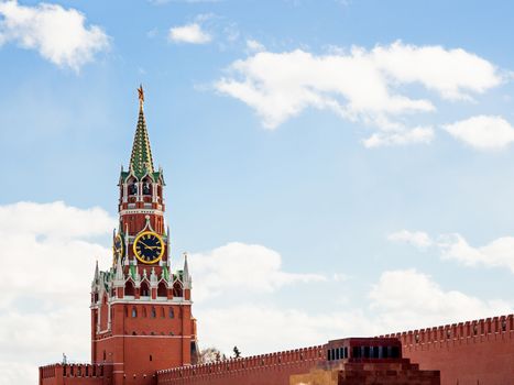 Famous Spasskaya tower with Kremlin chimes and red star on top. Historic landmark on Red Square in Moscow, Russia.