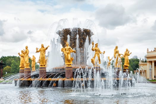 Fountain "Friendship of the people" at VDNH ("The Exhibition of achievements of national economy") in Moscow, Russia. Golden statues of women represent republics in the USSR.