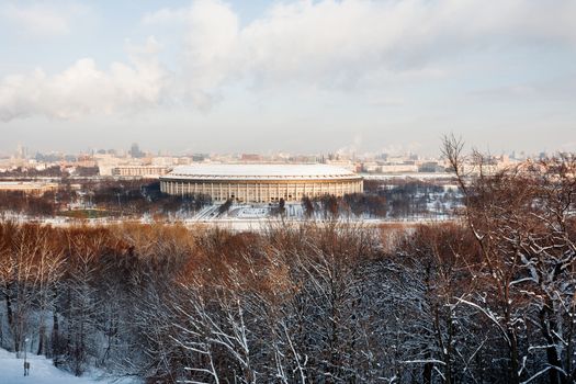 Panorama view on Luzhniki stadium and Sparrow Hills from observation deck near Moscow State Univercity (MSU). Winter sunny day. Moscow, Russia.