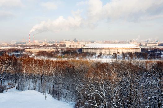 Panorama view on Luzhniki stadium and Sparrow Hills from observation deck near Moscow State Univercity (MSU). Aerial cityscape in winter sunny day. Moscow, Russia.