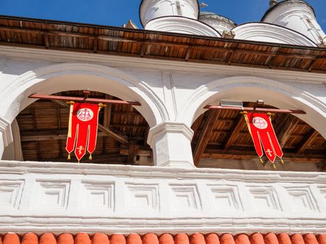 Red Khorugv with golden crosses, religious Easter decorations in orthodox church, Russia.