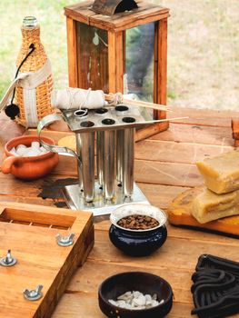 Old fashioned household items in markitant tent, set for candle and soap making. Historical reconstruction of 19th century. Festival Times and Epochs. Moscow, Russia.