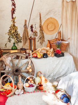 Old fashioned household items in markitant tent, historical reconstruction of 19th century. Festival Times and Epochs. Moscow, Russia.