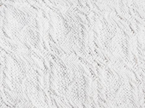 Texture of hand-woven white fabric. Rough threads, prominent textile pattern.