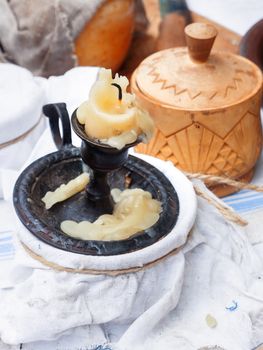 Old fashioned household items, set for candle and soap making. Historical reconstruction of 19th century. Festival Times and Epochs. Moscow, Russia.