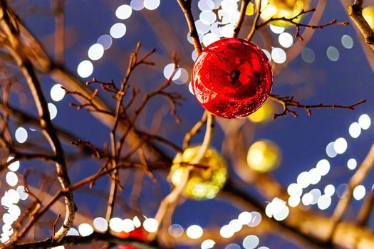 Streets of Moscow decorated for New Year and Christmas celebration. Tree with bright red and yellow balls. Russia.
