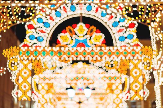 Streets of Moscow decorated for New Year and Christmas celebration. Buildings with light bulbs. Russia.