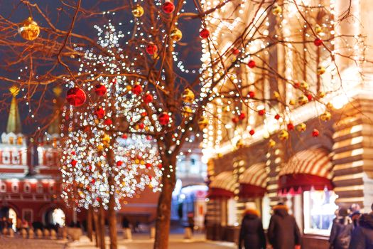 Streets of Moscow decorated for New Year and Christmas celebration. Tree with bright red and yellow balls. Russia.