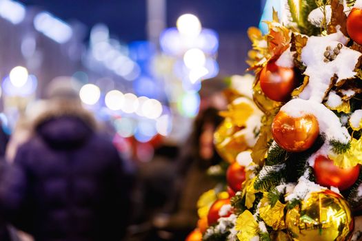 Outdoor decorations for New Year and Christmas celebration. Streets of Moscow decorated with light bulbs and colorful shiny balls. Russia.