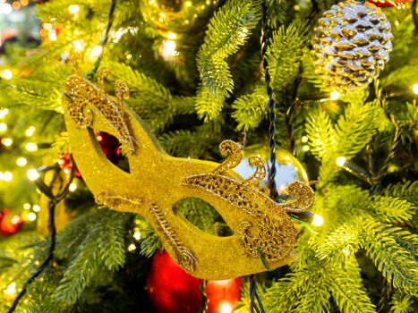 Christmas and New Year decoration - golden theatral mask. Outdoor decoration for Christmas tree.
