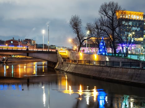 Gateway pedestrian bridge over Moscow-river. Night view on bridge between Kosmodamianskaya and Shluzovaya embankment. Moscow, Russia.