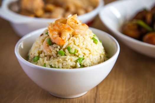 shrimp fried rice on wooden background