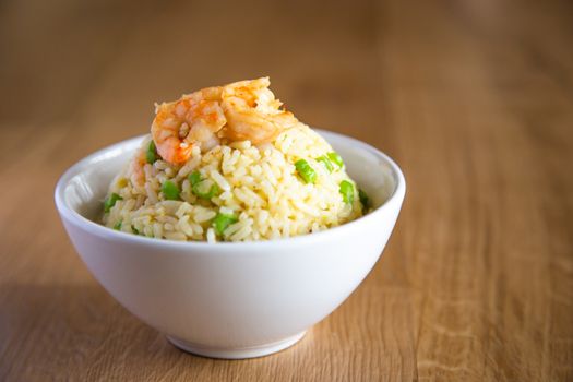 shrimp fried rice on wooden background