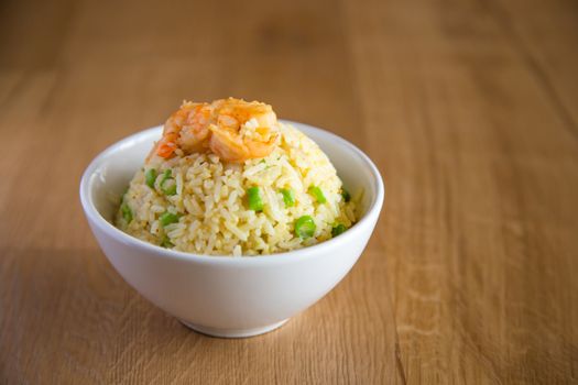 shrimp fried rice on wooden background