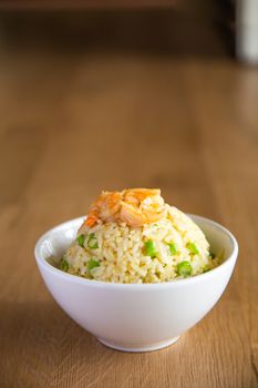 shrimp fried rice on wooden background