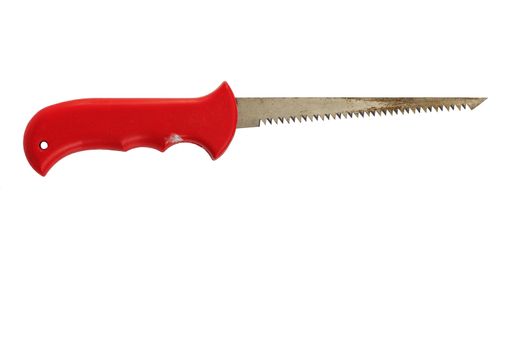 Manual narrow old saw for wood and pruning with a sharp end and a red plastic handle isolated on a white background.