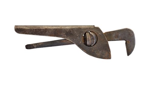 A very old, rusty pipe wrench is located horizontally and is isolated on a white background.