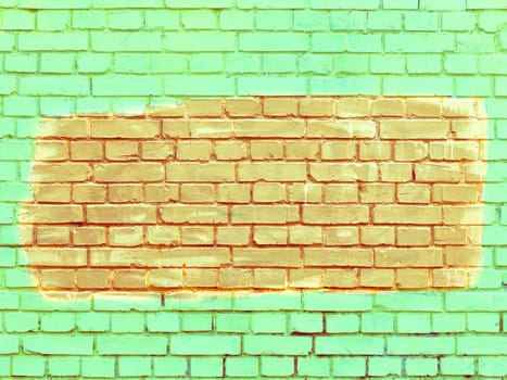Old brick walls are painted with bright green paint, and the selected fragment is orange.