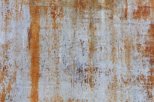 Old metal sheet with rust texture and gray weathered cracked paint.