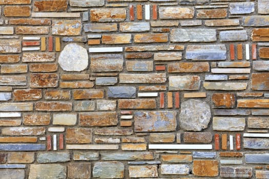 Wall mosaic from the texture of multi-colored sandstone