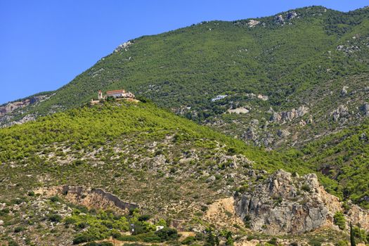 Bottom-up view of two monasteries, male and female, in the area of Loutraki, on the slope of the picturesque mountain of Gerania, Greece