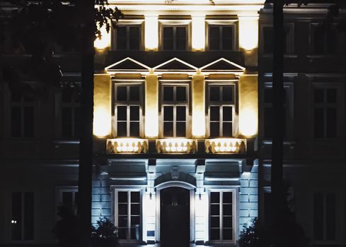 Exterior facade of classic building in the European city at night, architecture and design detail