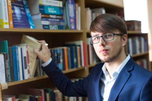 Belarus, Gomel, September 19, 2017. The main library. The day of open doors. An intimate man with glasses in the library. Student in the library