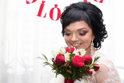 Portrait of a bride with a bouquet.