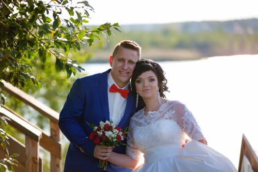 Portrait of the bride and groom in nature.