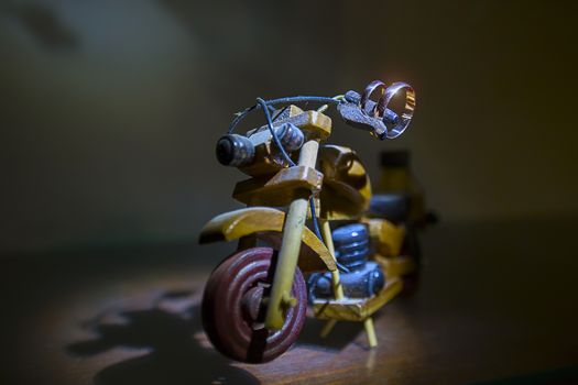Wedding rings on a toy wooden motorcycle.Wedding biker. Wedding rings. Wedding day.