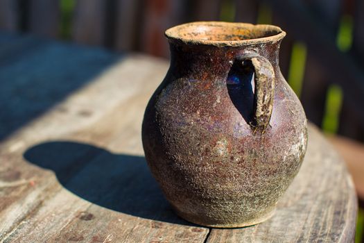 Old pitcher.An ancient decanter. Clay vessel. Ancient water tank