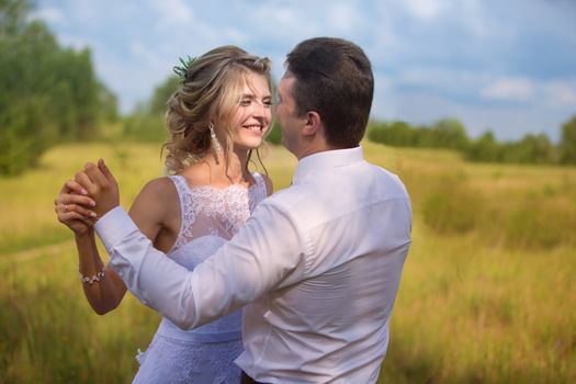 Wedding day.Joyful bride and groom outdoors.Wedding day. The bride and groom. A loving couple in nature.Love for men and women