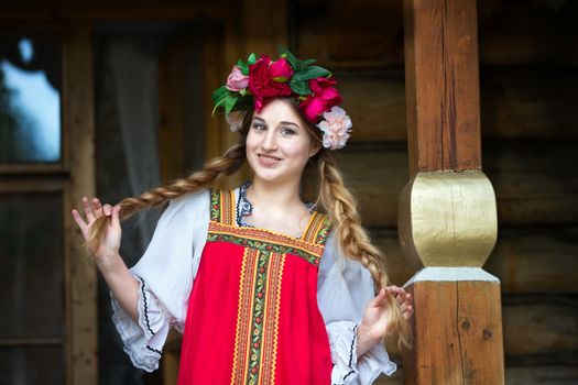 Beautiful woman portrait in russian style. Beautiful Russian girl in traditional dress. Russian style.