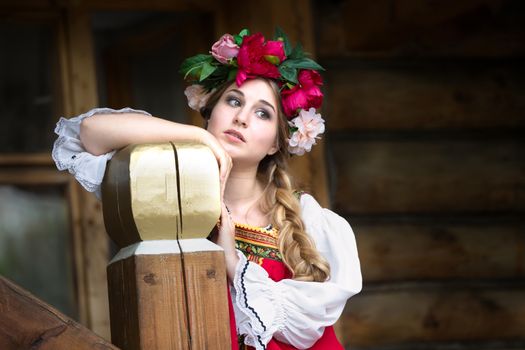 Beautiful woman portrait in russian style. Beautiful Russian girl in traditional dress. Russian style.