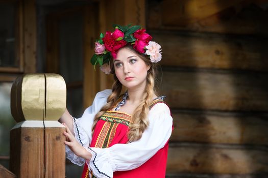 Beautiful woman portrait in russian style. Beautiful Russian girl in traditional dress. Russian style.