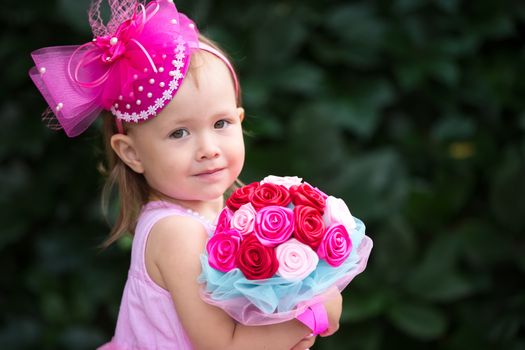 Little girl with a wedding bouquet