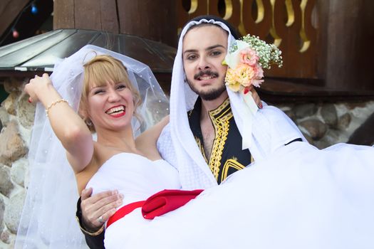 Russia, Moscow, Izmaylovsky Park, August 27, 2017. International Photo Festival.Wedding of an Arab and a Russian woman. Eastern groom and Russian bride