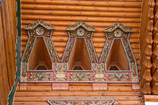 Wooden architecture. Russian block. Painted windows of ancient buildings