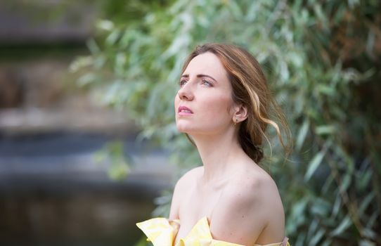 Russia, Moscow, Izmaylovsky Park, August 27, 2017. International Photo Festival.A suffering young woman. Suffering on the face.