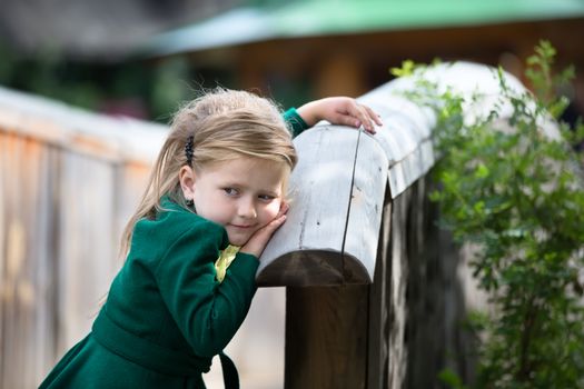 Russia, Moscow, Izmaylovsky Park, August 27, 2017. International Photo Festival.A little girl is pensive for a walk. Little girl in a coat on a walk