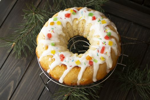 Traditional yeast cake covered with white icing and raisins Spongy yeast cake that is traditionally baked for Easter. Flat lay