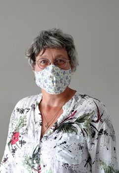 adult woman wearing protection face mask against coronavirus