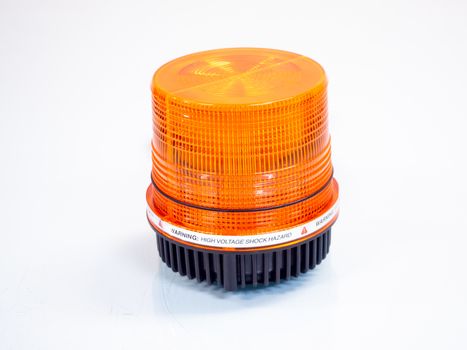 the Orange rotating beacon on white reflective background.