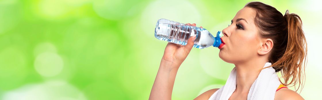 Healthy and Fitness lifestyle banner  - attractive young woman drinking water during workout on a fresh abstract background (copy space). 