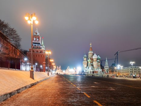 Famous landmarks - St. Basil Cathedral on Red square in Kremlin. Winter evening in Moscow, Russia.