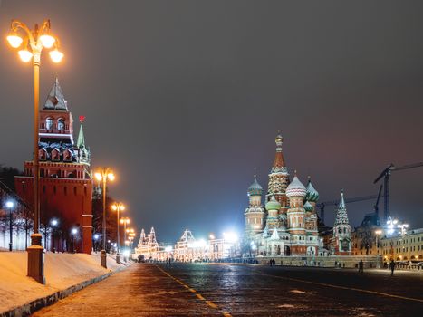 Famous landmarks - St. Basil Cathedral on Red square in Kremlin. Winter evening in Moscow, Russia.