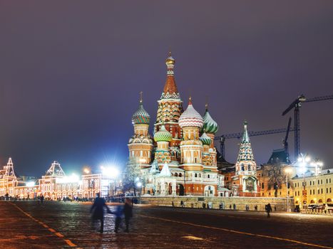 Famous landmarks - St. Basil Cathedral on Red square in Kremlin. Winter evening in Moscow, Russia.