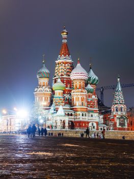 Famous landmarks - St. Basil Cathedral on Red square in Kremlin. Winter evening in Moscow, Russia.